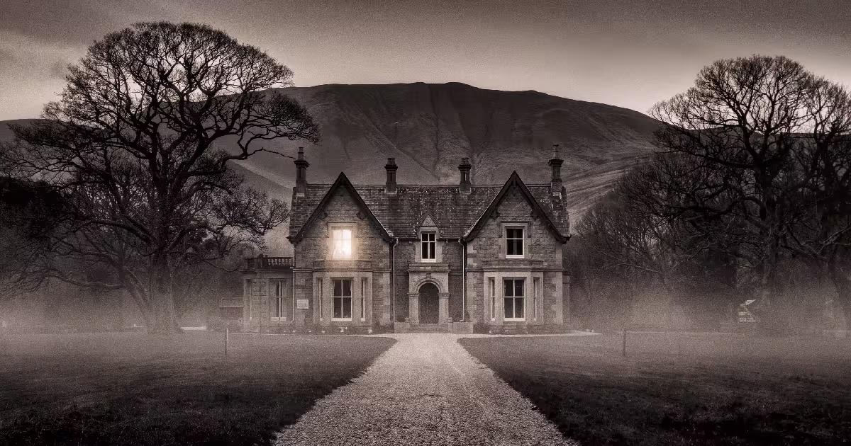 A grey stone country house with one lit window at the end of a long drive, in mist below the Perthshire hills. Illustration.