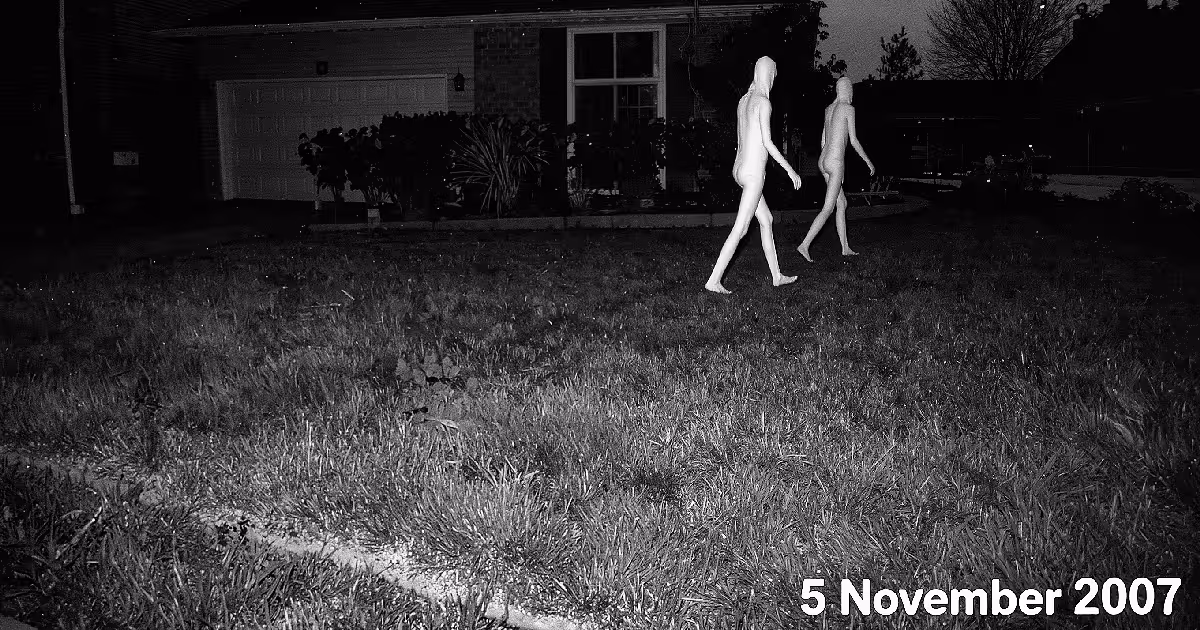 Two pale, long-legged figures cross a Fresno lawn at night. Illustration.